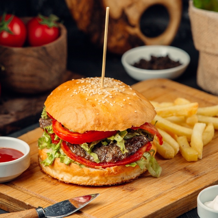 A gourmet cheeseburger with fresh salad and golden French fries served at Bodrum Kebab House in Hawick 