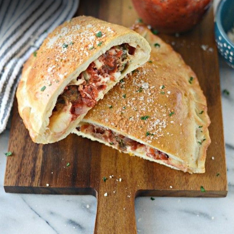 Freshly baked Doner Calzone filled with seasoned meat and cheese served at Bodrum Kebab House in Hawick 